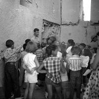 Students on a tour inside Casa Grande in 1956