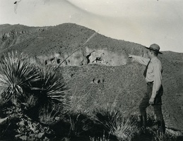 Ranger Pointing to the Upper Cliff Dwelling