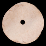 Spindle whorl made from deer scapula